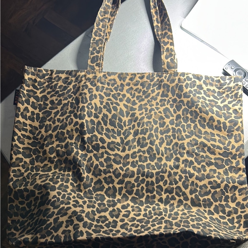 The is a J crew canvas tote bag leopard print